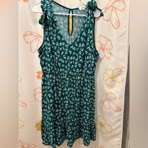 Cute Green mini dress with ruffles and white flower detail